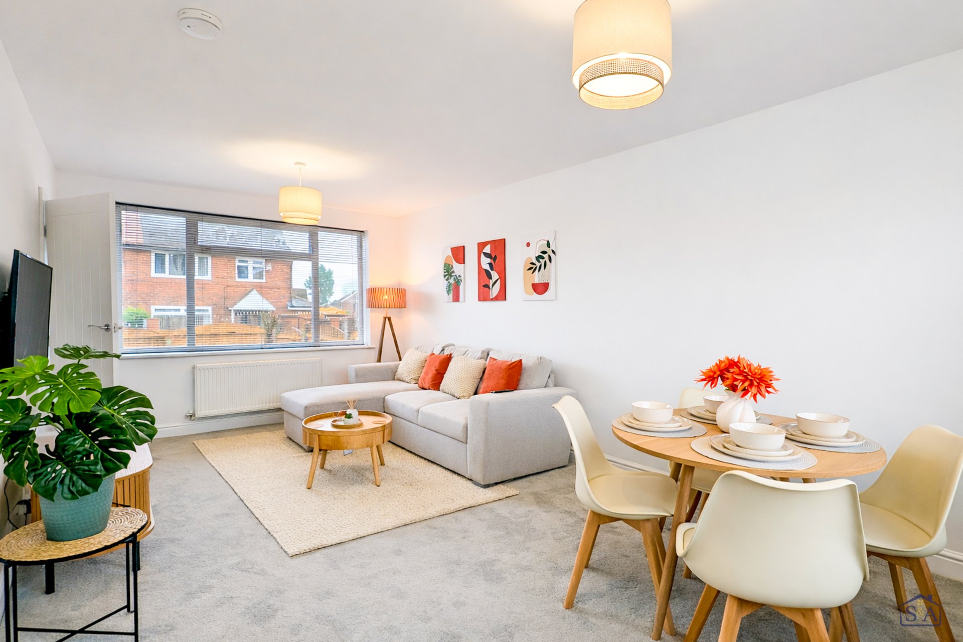 The light-filled living and dining space at S&A Stays Leeds