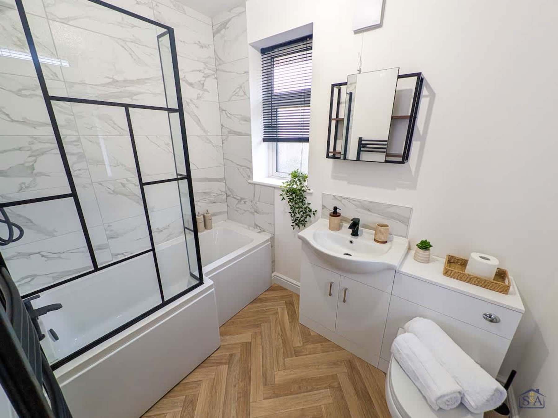 Fresh modern bathroom with bath and rainfall shower